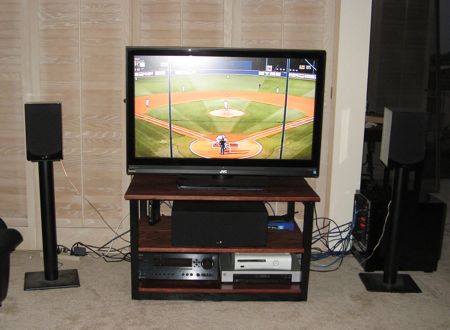 TV Stand in Living Room with TV On and Components Installed