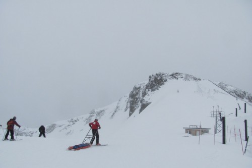 I like that the ski patrol is going after the guy before he's even fallen (or started downhill or gotten to the top).